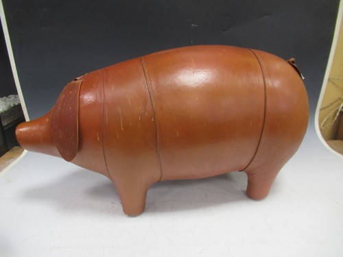 Lot 238 - A leather footstool in the form of a pig,...