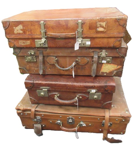 Lot 248 - Four vintage leather suitcases, largest, 84 x...