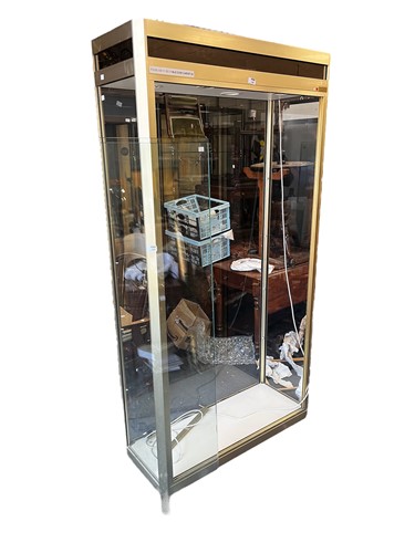 Lot 782 - A modern glazed display cabinet with locking...