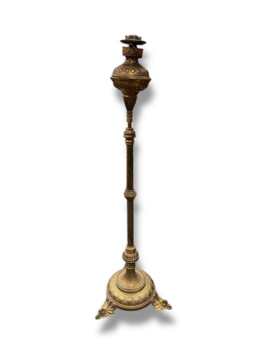 Lot 667 - A Victorian brass oil lamp with wrythen column,...