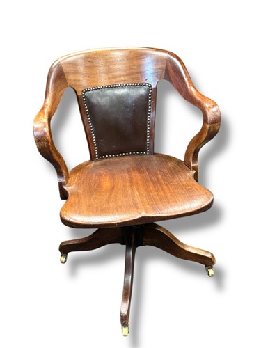 Lot 693 - A 19th century revolving desk chair with...