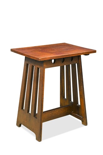 Lot 184 - In the manner of Liberty & Co., an Arts & Crafts oak occasional table