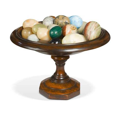 Lot 520 - A turned wooden tazza together with a collection of agate, marble and hardstone eggs, modern