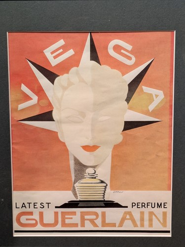 Lot 293 - A small Guerlain framed lithographic poster,...