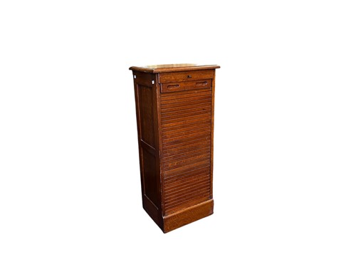 Lot 634 - An early 20th century oak tambour fronted...