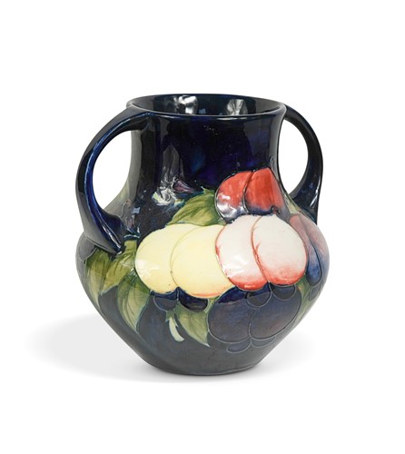 Lot 32 - A Moorcroft Wisteria pattern twin-handled vase, circa 1920