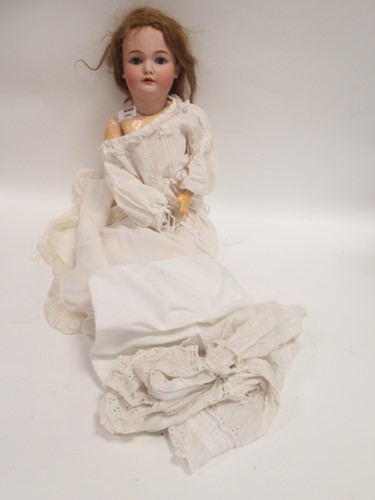 Lot 241 - An early 20th century bisque headed doll 55cm...