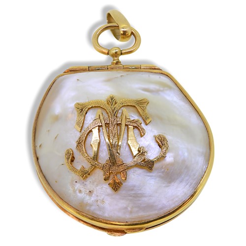 Lot 84 - A monogrammed mother of pearl locket