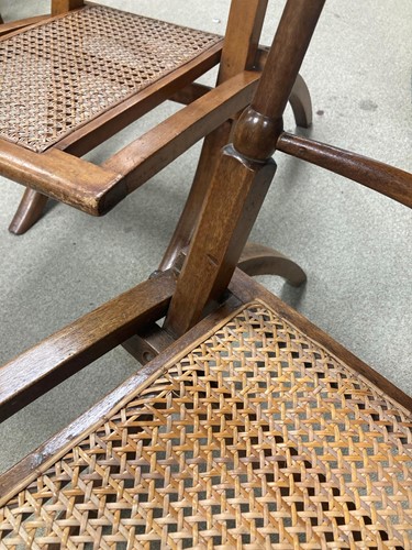 Lot 175 - In the manner of E.W.Godwin, a pair of Aesthetic movement 'campaign' chairs, circa 1880