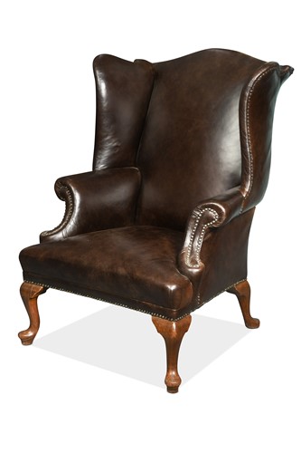 Lot 337 - A brown leather wing back armchair, mid-18th century style