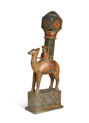 Lot 447 - An antique Rajasthani painted wooden camel with rider