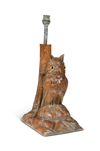 Lot 526 - A carved wood Black Forest table lamp in the form of an Owl, circa 1900