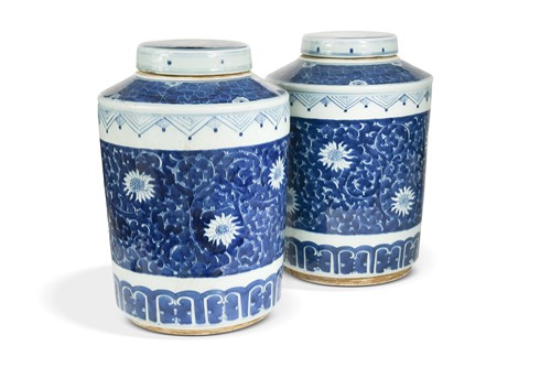 Lot 55 - A pair of Chinese stoneware cylindrical blue and white lidded jars, modern