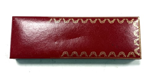 Lot 322 - Cartier - A 'Les Must de Cartier Trinity' gold-plated rollerball pen case