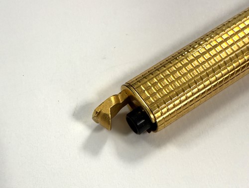 Lot 322 - Cartier - A 'Les Must de Cartier Trinity' gold-plated rollerball pen case