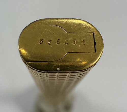 Lot 322 - Cartier - A 'Les Must de Cartier Trinity' gold-plated rollerball pen case