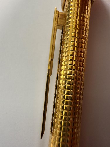 Lot 322 - Cartier - A 'Les Must de Cartier Trinity' gold-plated rollerball pen case