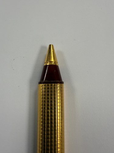 Lot 322 - Cartier - A 'Les Must de Cartier Trinity' gold-plated rollerball pen case