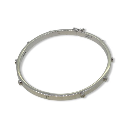 Lot 74 - A 9ct gold diamond set bangle