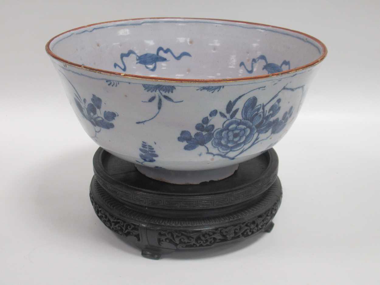 Lot 20 - An 18th century Delft blue and white bowl, on...