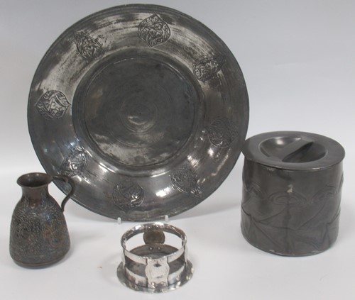Lot 39 - A Tudric pewter tobacco jar and cover together...