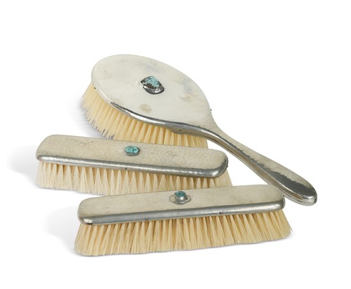 Lot 202 - A Liberty Tudric pewter dressing table part set