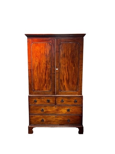 Lot 625 - An early 19th century mahogany linen press,...