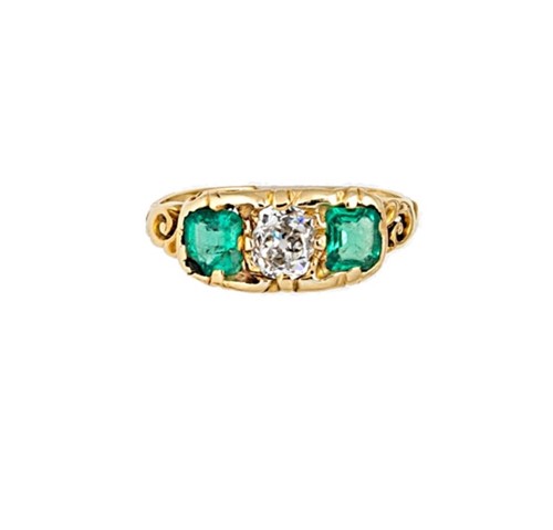 Lot 126 - A diamond and emerald three stone ring