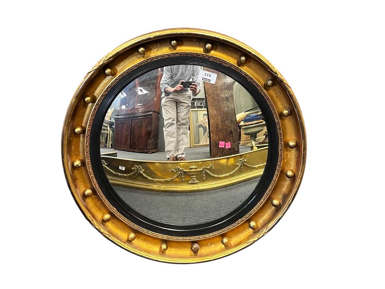 Lot 633 - A Regency style gilt convex mirror, with ball...
