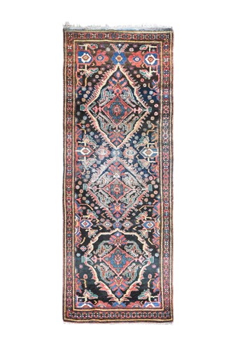 Lot 281 - A Hamadan triple-medallion runner rug, circa 1950