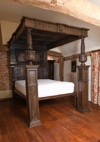 Lot 531 - An imposing carved oak and panelled tester bed, 17th century and later