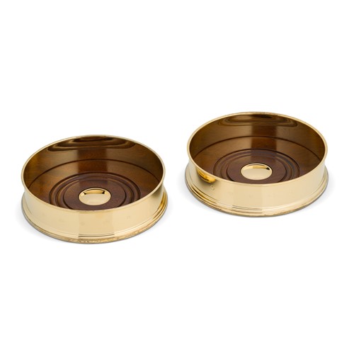 Lot 466 - A pair of Elizabeth II silver gilt bottle coasters