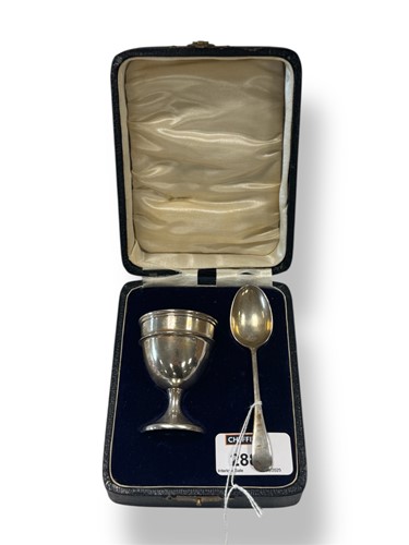 Lot 288 - A cased silver egg cup and spoon