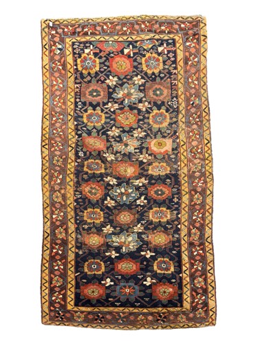 Lot 704 - An antique Karabagh rug, the central reserve...