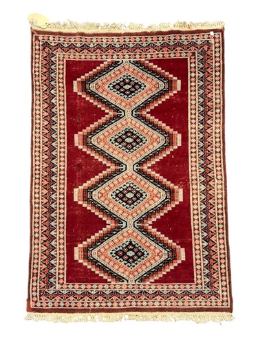 Lot 713 - Three vintage rugs; one with aztec style...