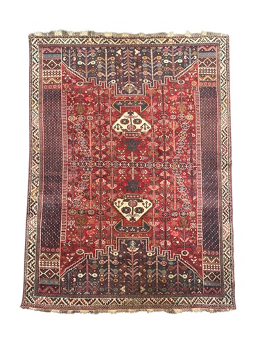 Lot 716 - A vintage Qashqai carpet, the complex pattern,...