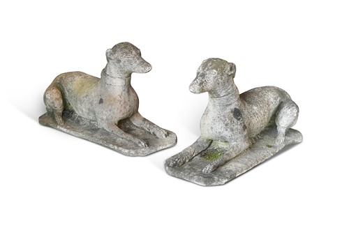 Lot 598 - A pair of re-constituted stone whippets