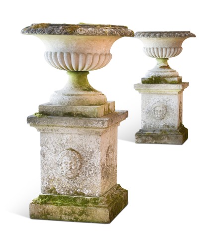 Lot 604 - A pair of re-constituted stone Campana urns on plinths