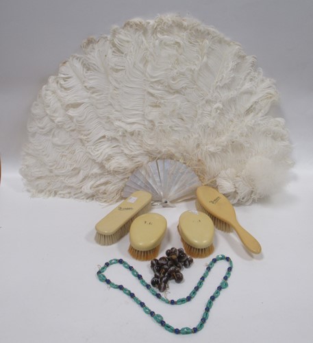 Lot 186 - A mother-of-pearl handled Ostrich feather fan,...