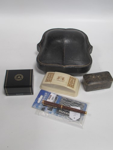 Lot 243 - A Waterman fountain pen, the nib marked 18K...