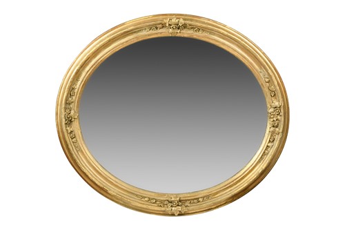 Lot 466 - A large Victorian oval giltwood and gesso mirror