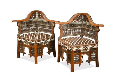 Lot A pair of North African bone and ebony inlaid corner chairs, early 20th century
