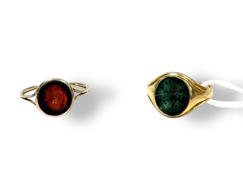 Lot 309 - A bloodstone intaglio ring tested as 18ct with...