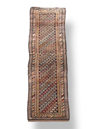 Lot 557 - A late 19th century Caucasian runner, (cut and...