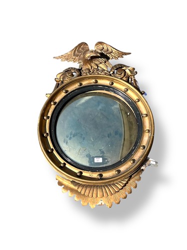 Lot 481 - A Regency circular convex gilt framed mirror