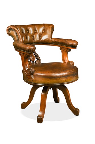 Lot 565 - A Victorian walnut swivel desk chair