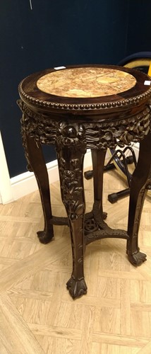 Lot 672 - An Oriental carved and pierced hardwood stand...