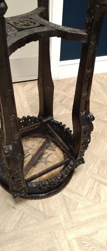 Lot 672 - An Oriental carved and pierced hardwood stand...