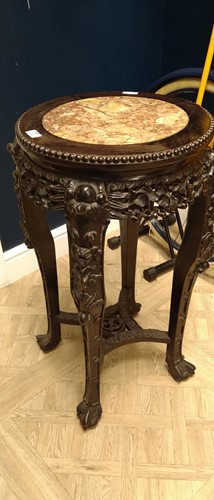 Lot 672 - An Oriental carved and pierced hardwood stand...