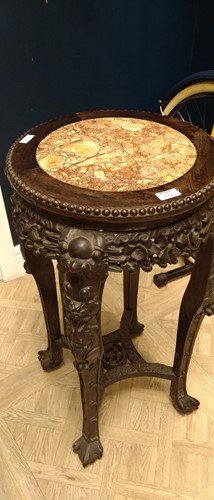 Lot 672 - An Oriental carved and pierced hardwood stand...